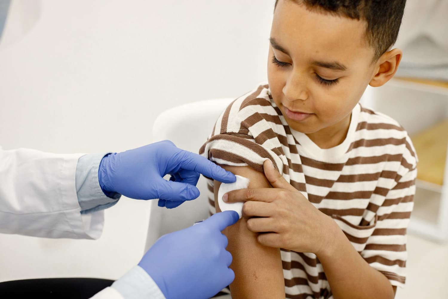 Pharmacist administering a childhood vaccine